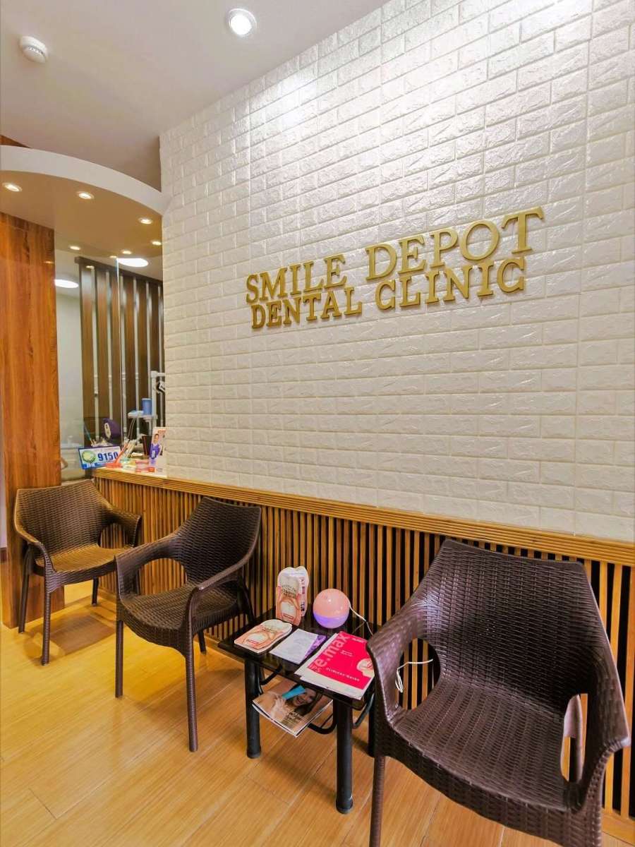 A photo that contains a cozy lounge of the Smile Depot Dental Clinic with modern design and wooden accents.